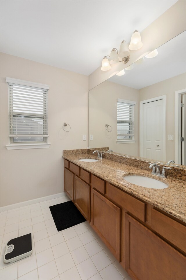 bathroom featuring vanity, a wealth of natural light, and tile patterned floors