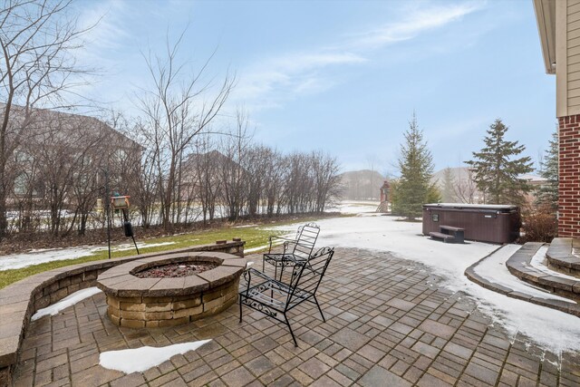 view of patio featuring a fire pit and a hot tub