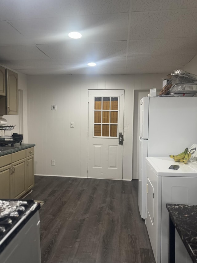 kitchen featuring dark hardwood / wood-style flooring, washer / dryer, and white fridge