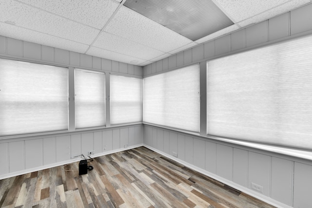 unfurnished sunroom with a paneled ceiling