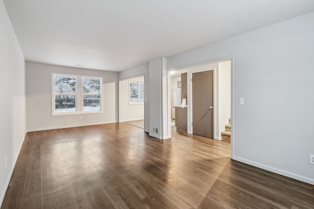 spare room featuring dark hardwood / wood-style floors