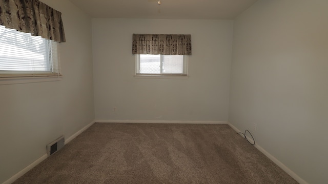 empty room featuring carpet flooring