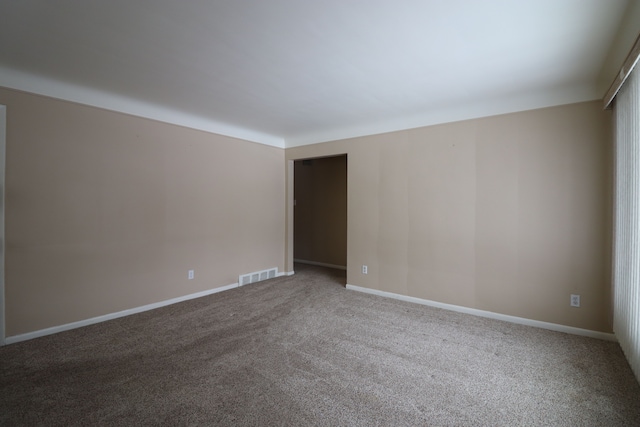 unfurnished room featuring carpet flooring