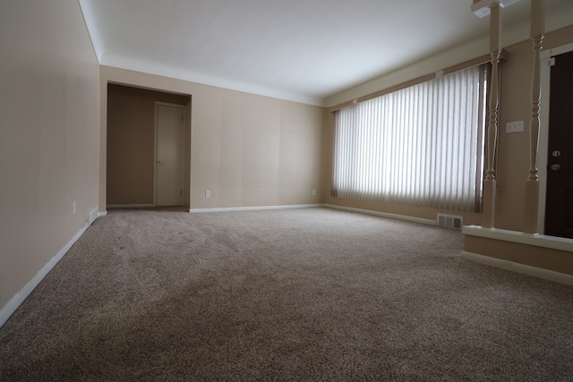 spare room featuring carpet