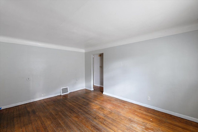 spare room with hardwood / wood-style flooring