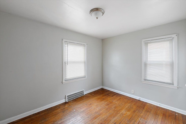 unfurnished room featuring wood-type flooring