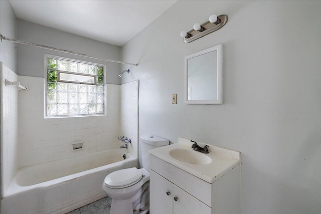 full bathroom featuring vanity, toilet, and tiled shower / bath combo