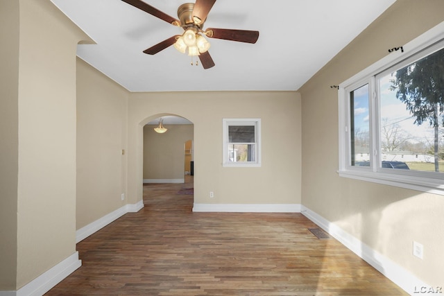 spare room with hardwood / wood-style flooring and ceiling fan