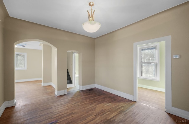 unfurnished room featuring hardwood / wood-style floors