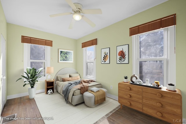 bedroom featuring hardwood / wood-style flooring and ceiling fan