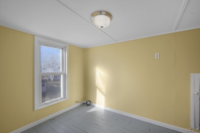 spare room with hardwood / wood-style floors