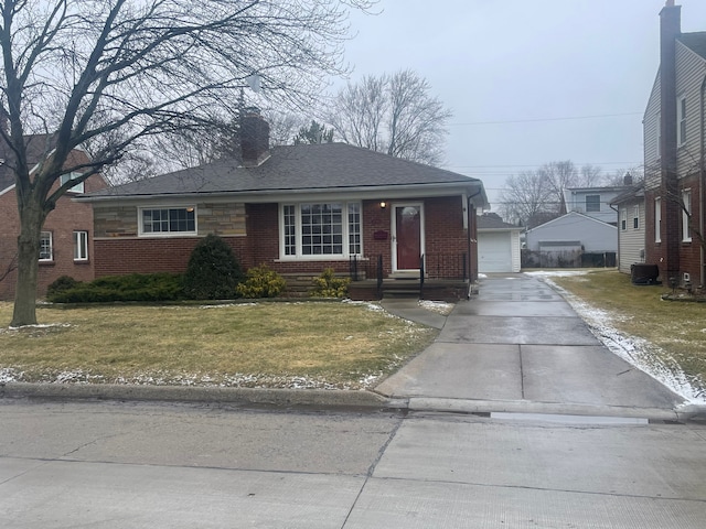 view of front of property with central AC unit and a front lawn