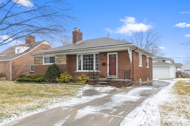 view of front facade featuring a garage and an outdoor structure