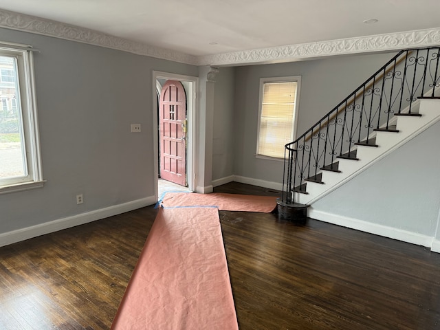 foyer with dark hardwood / wood-style floors