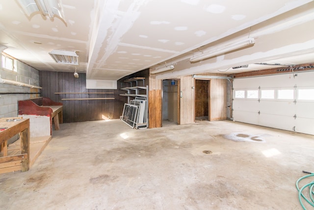 garage with visible vents and concrete block wall