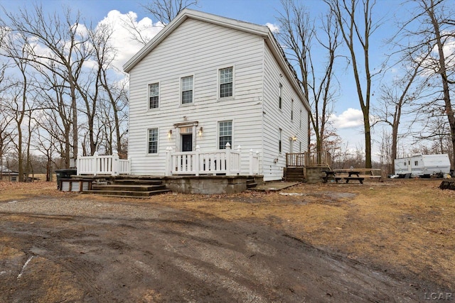 view of front of house featuring a wooden deck