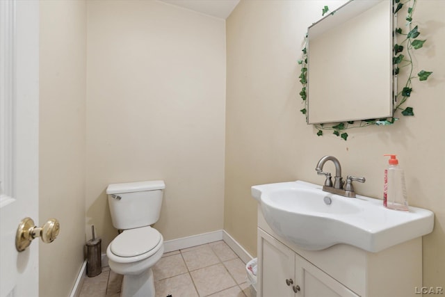 bathroom with tile patterned floors, vanity, and toilet