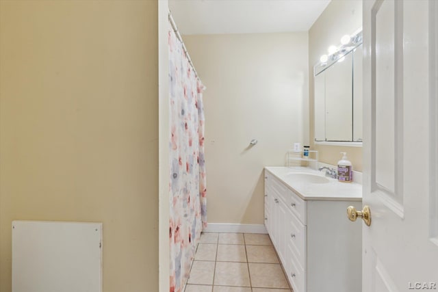 bathroom with tile patterned flooring and vanity