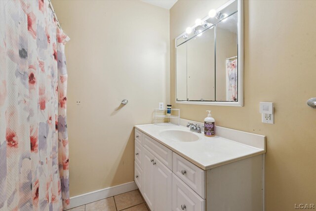 bathroom with vanity and tile patterned flooring