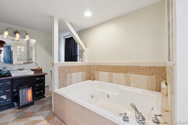 bathroom featuring a relaxing tiled tub, vanity, and tile patterned floors