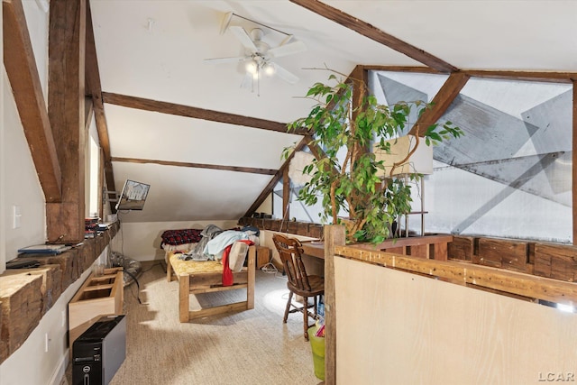 interior space with vaulted ceiling with beams and ceiling fan