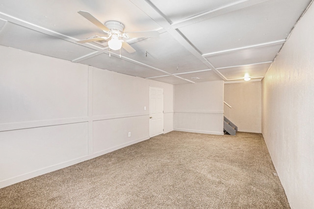 empty room featuring ceiling fan and carpet floors