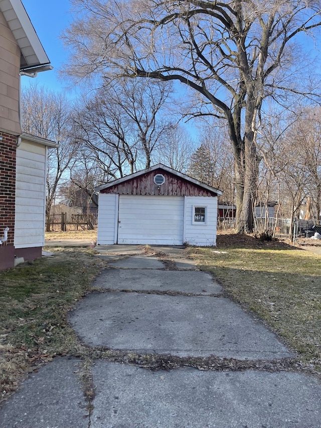 detached garage featuring driveway