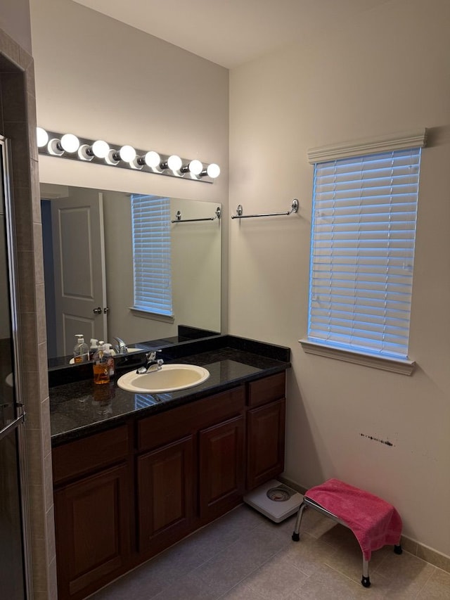 bathroom featuring vanity and tile patterned flooring