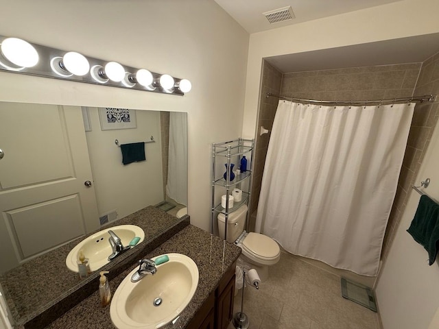 bathroom with vanity, toilet, and curtained shower