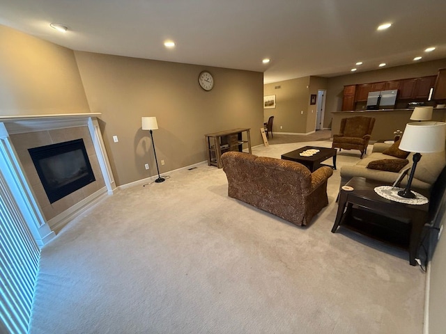 carpeted living room featuring a fireplace