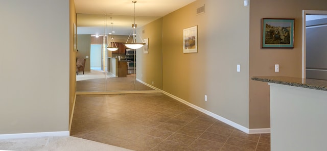 6713 Boulder Pointe Dr, Washington, MI 48094 - hall with baseboards and tile patterned flooring