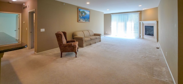 6713 Boulder Pointe Dr, Washington, MI 48094 - sitting room featuring carpet floors, baseboards, a glass covered fireplace, and recessed lighting