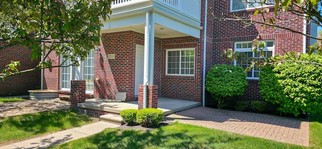 6713 Boulder Pointe Dr, Washington, MI 48094 - view of exterior entry featuring brick siding