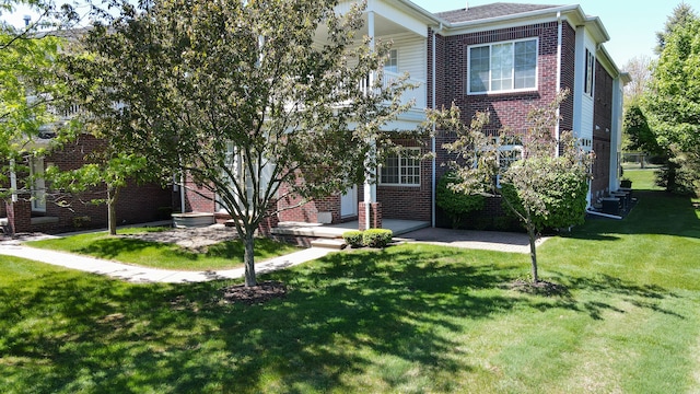 6713 Boulder Pointe Dr, Washington, MI 48094 - view of front of home with a front lawn and brick siding