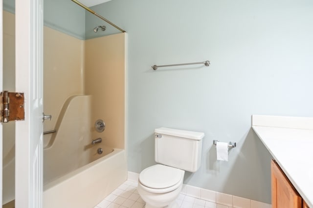 full bathroom featuring washtub / shower combination, vanity, toilet, and tile patterned flooring