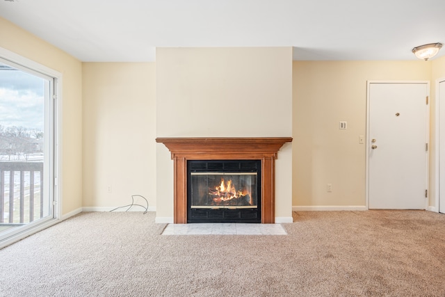 unfurnished living room with light carpet