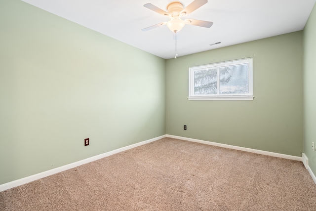 empty room featuring carpet and ceiling fan