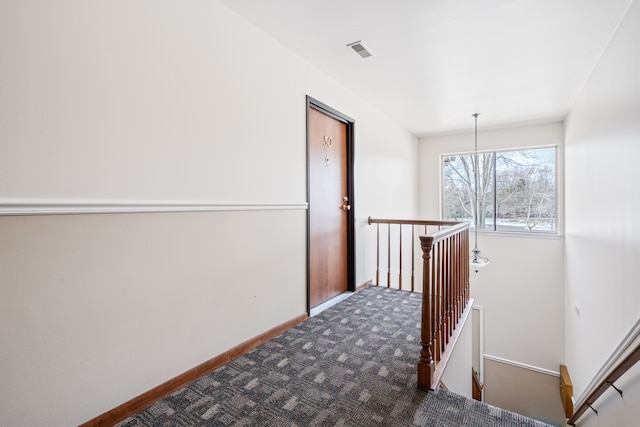 corridor featuring carpet flooring