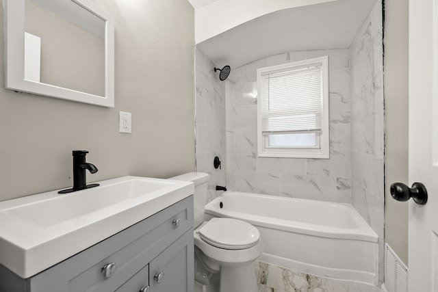 full bathroom featuring tiled shower / bath combo, vanity, and toilet