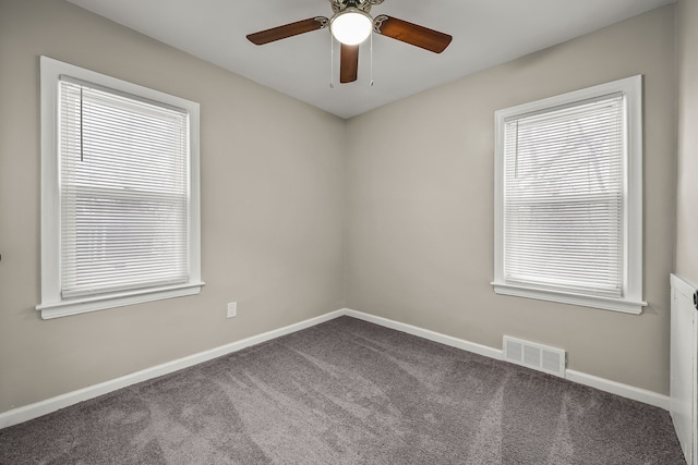 spare room with carpet floors and ceiling fan