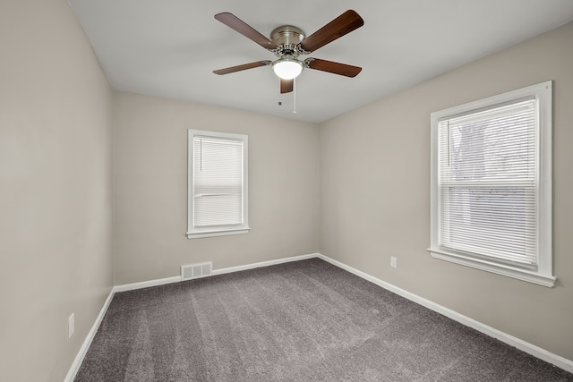 unfurnished room featuring carpet and ceiling fan