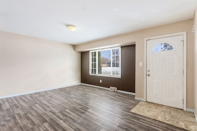 foyer entrance featuring wood-type flooring