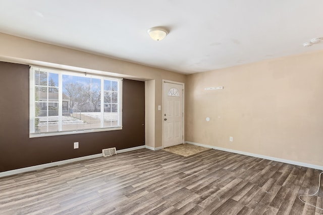 unfurnished room featuring light hardwood / wood-style floors