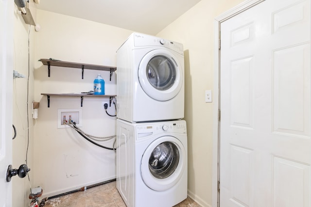 washroom with stacked washer / drying machine