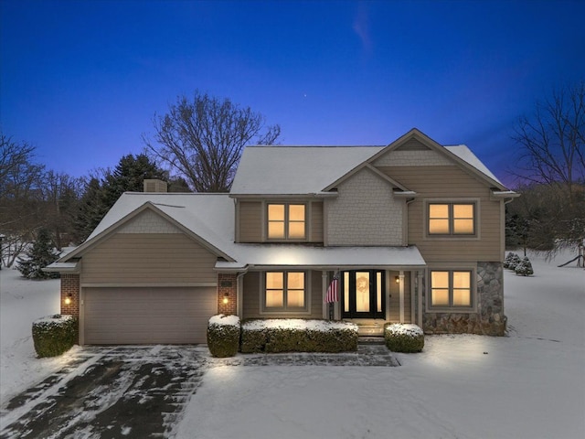 view of front of home with a garage and covered porch