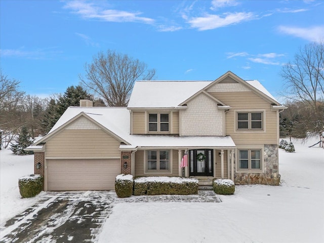 view of front of house featuring a garage and a porch