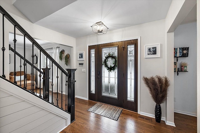 foyer entrance with dark wood-type flooring