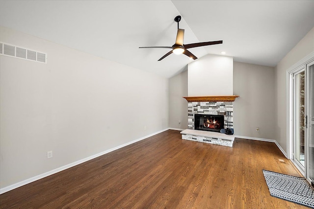 unfurnished living room featuring lofted ceiling, hardwood / wood-style floors, a fireplace, and ceiling fan