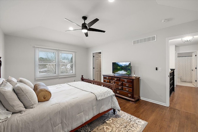 bedroom with dark hardwood / wood-style flooring, lofted ceiling, and ceiling fan