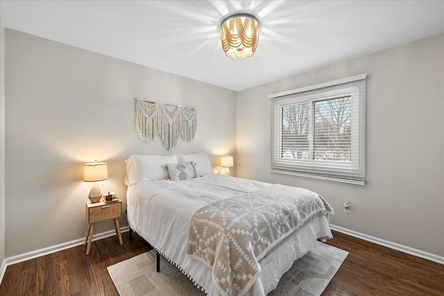 bedroom featuring dark hardwood / wood-style flooring